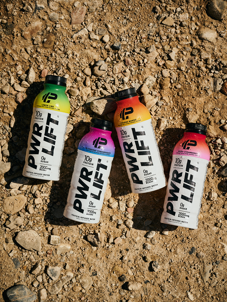 Four bottles of all flavors PWR LIFT on the ground 